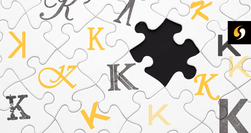 Białe puzzle z różnymi grafikami obrazującymi litery K